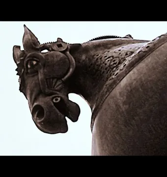 Anscavallo’s dark metallic horse head and neck with a stylized bridle and perforated patterns.