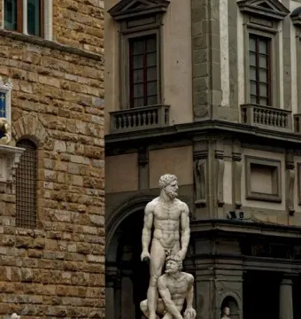 Hercules and Cacus marble sculpture with two nude muscular figures in a public square