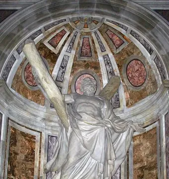 Statue of Saint Andrew in a vaulted niche with marble and gold accents.
