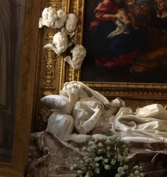 Ecstasy of Blessed Ludovica Albertoni, a white marble sculpture of a reclining woman with her head tilted back and hands crossed on her chest.