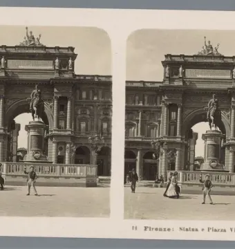 The Victor Emmanuel II Monument in a wide plaza, with a horseback statue in front of a triumphal arch and a few pedestrians nearby.