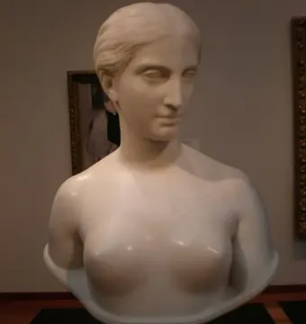 California, a white marble bust of a woman with classical hair and a serene expression on a pedestal.