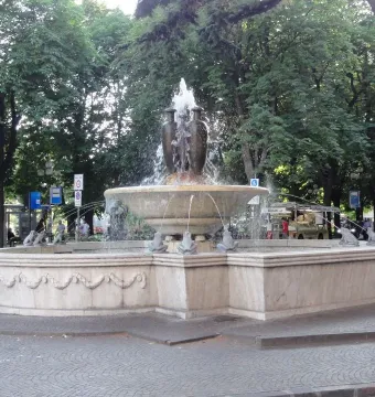 Fountain of the Frogs stone fountain with water cascading into a circular basin