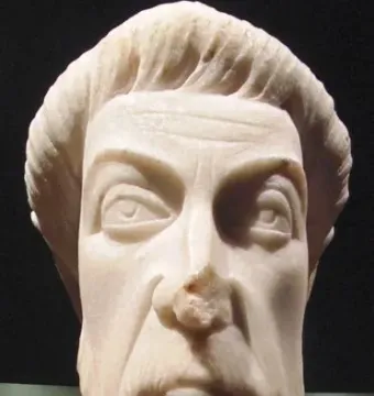 Head of Eutropius, a light-colored stone bust with an elongated face, wavy hair, and a short beard.
