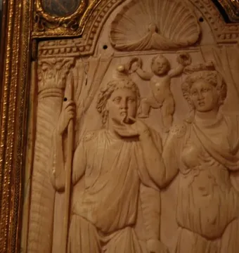 Queriniano Diptych with a classical relief carving of two figures and a cherubic figure above them