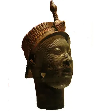 Bronze Head from Ife with a striated facial surface and ornate headpiece topped by a spiraled finial.