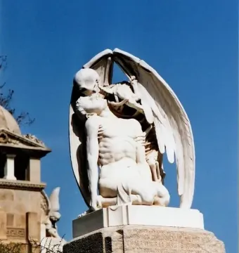 The Kiss of Death marble sculpture showing a winged skeleton kissing a kneeling man.