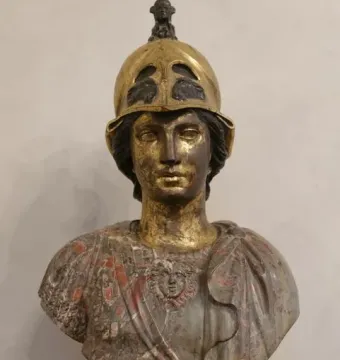Bust of Athena Giustiniani with a gilded female head and helmet above a mottled marble torso with drapery and a Medusa head.