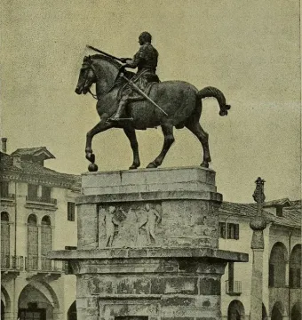 Gattamelata equestrian statue of a helmeted rider on horseback, mounted on a tiered stone pedestal with reliefs.
