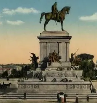 The Monument to Giuseppe Garibaldi, an equestrian statue on an ornate pedestal, with a city dome in the background and pedestrians at the base.