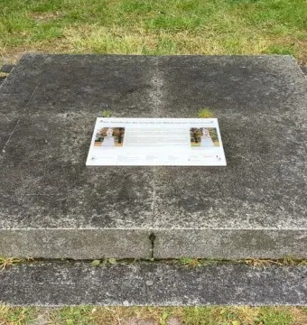 Overhead view of the Bülow Monument pedestal with an information plaque on top.