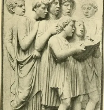 Cantoria relief with youthful figures in classical dress, including one holding an open book and others appearing to sing.
