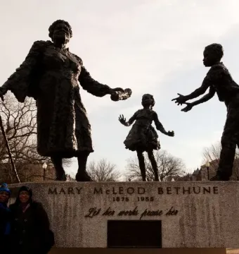 Mary McLeod Bethune Memorial with a bronze statue of Mary McLeod Bethune and two children figures on a stone pedestal