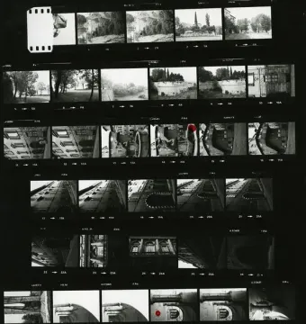Black-and-white contact sheet showing multiple small frames of outdoor scenes, buildings, and architectural details, including the Dolphin Fountain.