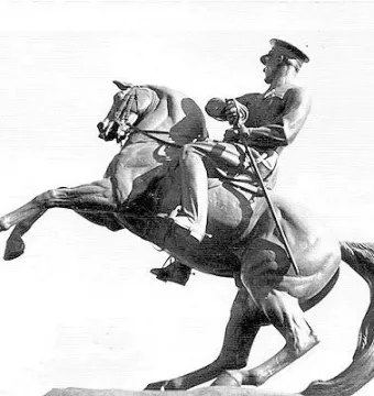 Statue of Honor, an equestrian sculpture of a man in military uniform holding a sword on a rearing horse.