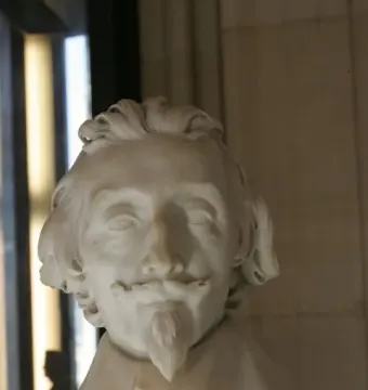 Marble bust of Cardinal Richelieu with wavy hair, mustache, and pointed goatee.