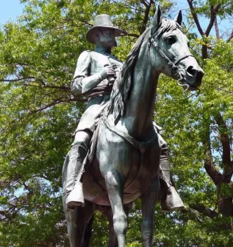 Ambrose Burnside equestrian monument showing a bronze man in uniform riding a horse.