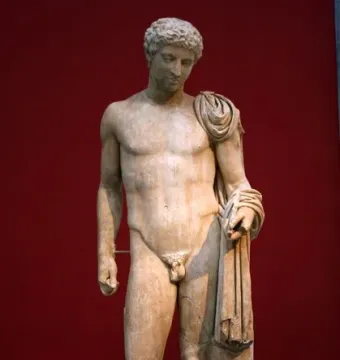 Hermes of Aegium marble statue of a nude male figure with drapery over one shoulder and a tree trunk support