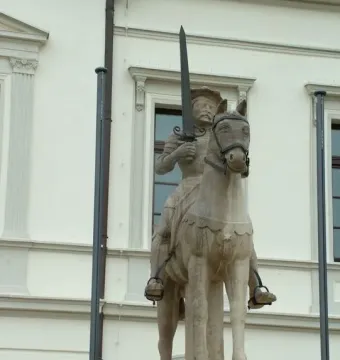 Haldensleben Roland statue of a crowned figure holding a sword while mounted on a horse.
