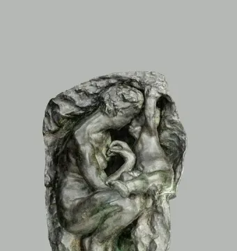 Young Mother in the Grotto, a dark bronze sculpture of a crouching woman cradling a child inside a textured grotto-like form.