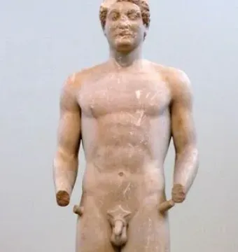 Aristodikos Kouros, a nude marble male statue with missing forearms, standing on a base.