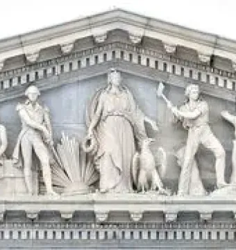 Apotheosis of Democracy pediment with a central standing figure and flanking sculpted groups on the U.S. Capitol