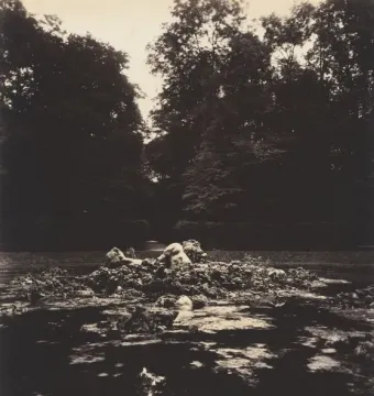 Enceladus Fountain rising from a dark pool of water with a stone figure among the rocks and a plume of water behind it