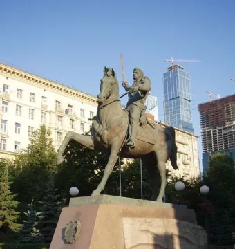 Pyotr Bagration monument showing a bronze equestrian statue on a multi-tiered granite pedestal in a paved plaza.