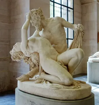Satyre et bacchante marble sculpture showing two intertwined figures, with a bearded male supporting a reclining female figure.