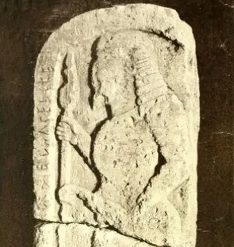 Stele of Avile Tite showing a carved warrior in profile with a spear and round shield on a weathered stone slab.