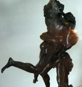Hercules and Antaeus bronze sculpture showing two muscular figures in a wrestling struggle, one lifting the other off the ground.