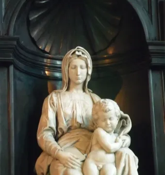 Madonna of Bruges marble sculpture of a seated woman holding the infant Jesus