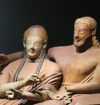 Sarcophagus of the Spouses showing two reclining terracotta figures, a woman and a bearded man, with archaic smiles.