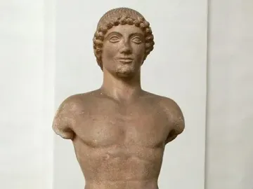 Apollo Strangford, a standing nude male statue with short curly hair and missing arms.
