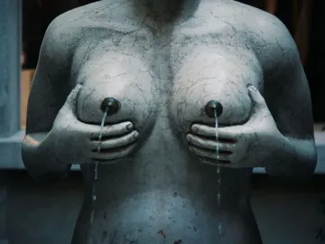 Fontana delle Tette stone sculpture with water flowing from the breasts.