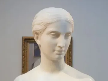 California, a white marble bust of a woman with short hair and bare shoulders on a pedestal
