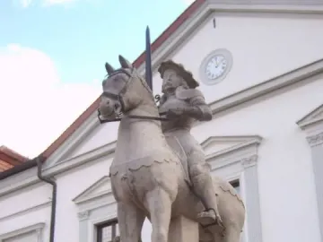 Haldensleben Roland equestrian statue with a knight holding a raised sword on a stone pedestal.