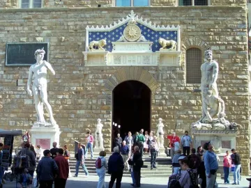 Hercules and Cacus marble sculpture with two nude muscular figures in a public square