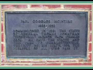 Bronze commemorative plaque for Stonewall Jackson mounted on a red brick wall.