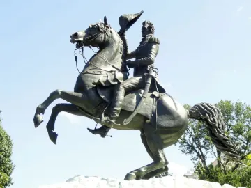 Andrew Jackson statue on a rearing horse against a blue sky