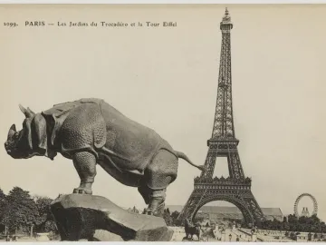 Rhinoceros sculpture in profile with the Eiffel Tower in the background
