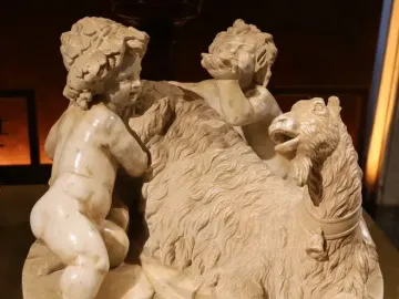 The Goat Amalthea sculpture showing two cherubic children with a recumbent goat.