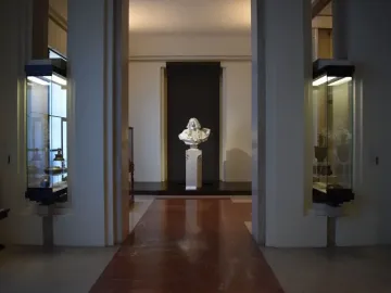 Bust of Francesco I d\'Este on a pedestal at the end of a museum hall.