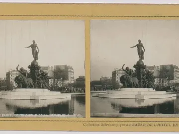 The Triumph of the Republic monument with a female figure atop a globe, surrounded by allegorical figures and lions in a shallow basin.