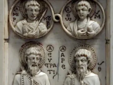 Harbaville Triptych ivory relief with four haloed figures, including two standing saints below and two roundels above.