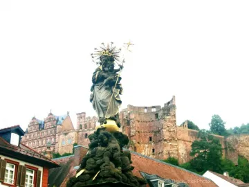 Kornmarkt Madonna, a robed Madonna holding the Christ Child with a starry halo and cross-topped staff, stands above an ornate base.