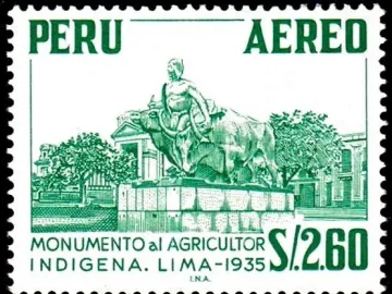 La yunta monument showing a seated man on a large horned bovine beside another bovine on a tiered pedestal.