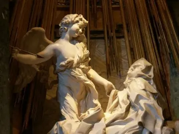 The Ecstasy of Saint Teresa by Bernini, showing a winged angel and a reclining woman beneath golden rays.