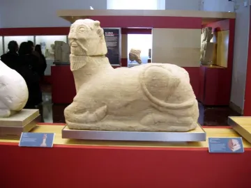 Bicha of Balazote stone sculpture with a human head and reclining animal body