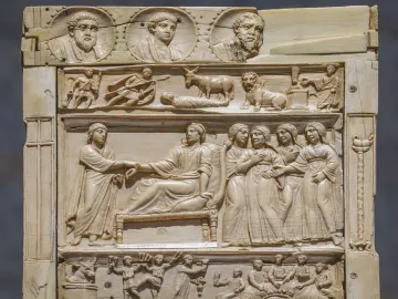 Brescia Casket with richly carved relief panels showing figures, animals, and medallions.